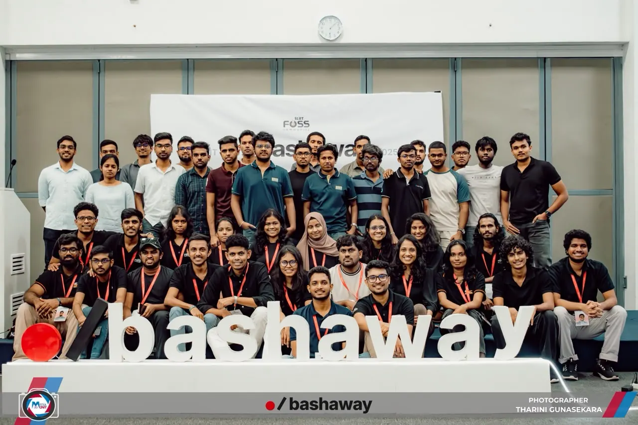 Organizers and participants gathered for a group photo behind the Bashaway sign